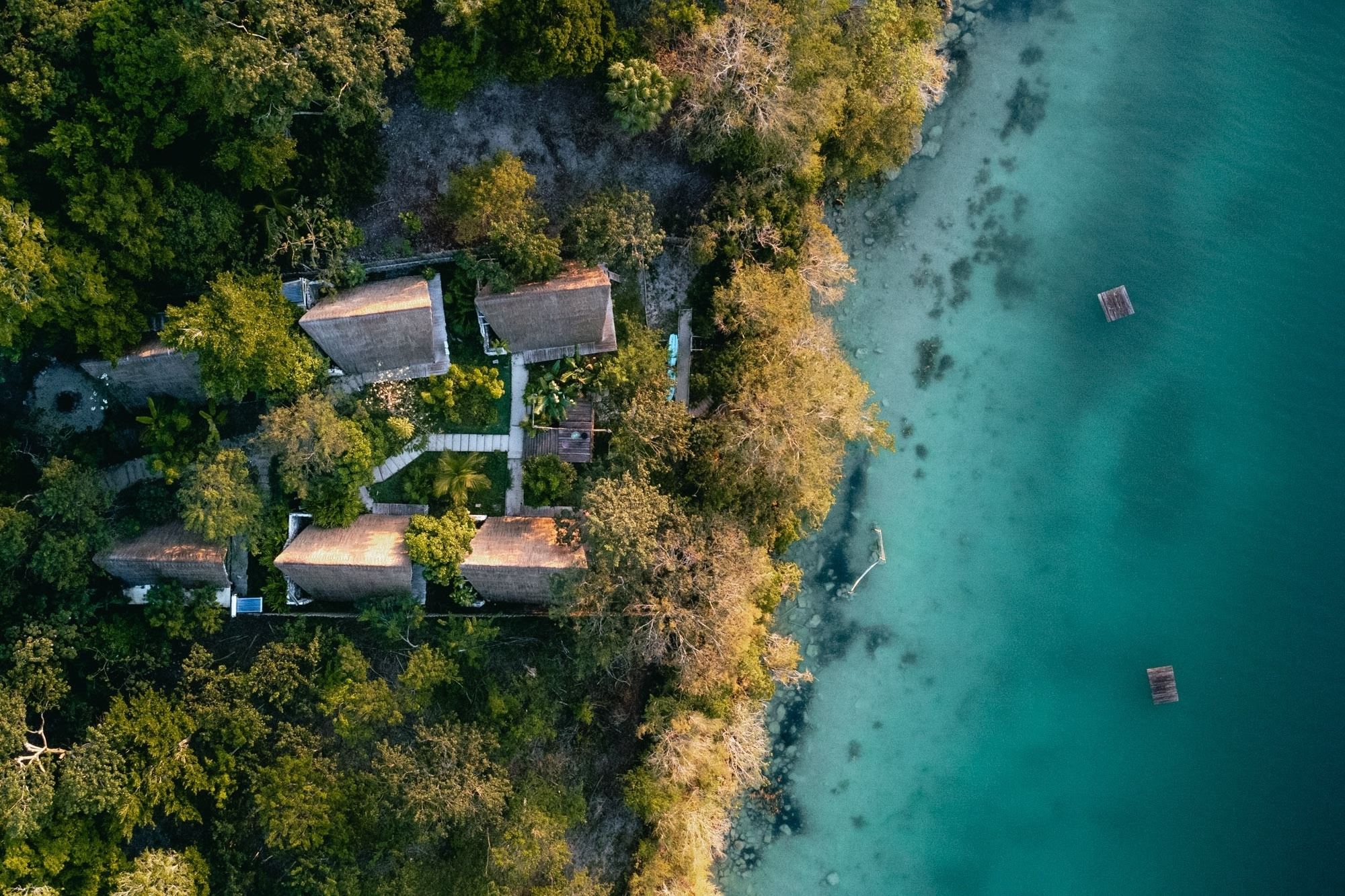 Drone view of the hotel Azul Nomeolvides amidst the maya Jungle at Bacalar Lagina, Mexico