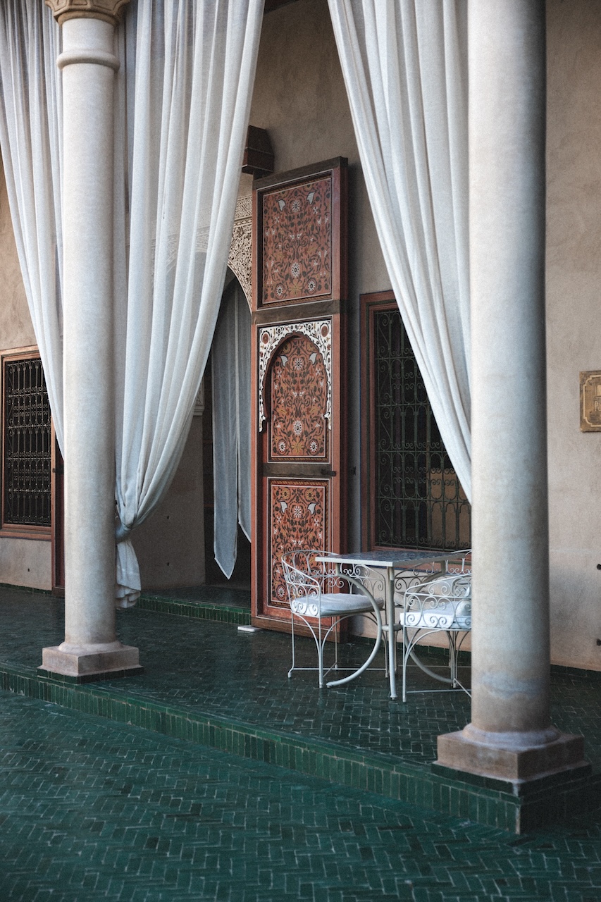 Lush greenery and traditional architecture of the Secret Garden in Marrakech